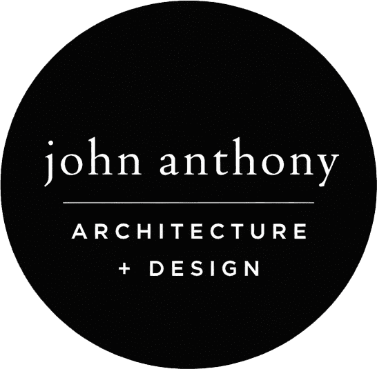 Black circular logo with the text "john anthony" above a line, and "ARCHITECTURE + DESIGN" below the line, all in white font.