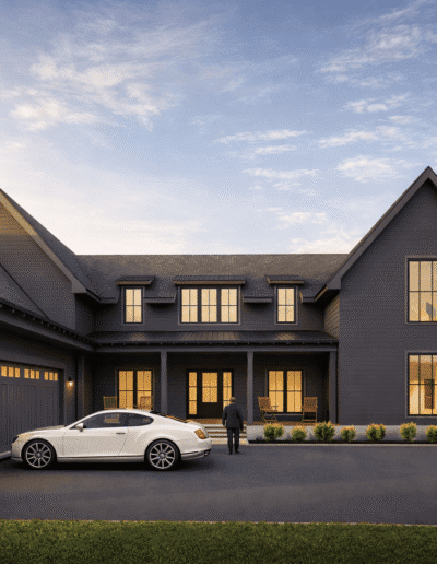 A modern two-story dark gray house with large windows, a three-car garage, a white car parked in the driveway, and a person walking toward the entrance at sunset.